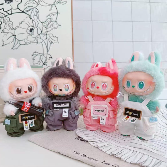 Four colorful plush toys with animal-themed designs on a white surface.