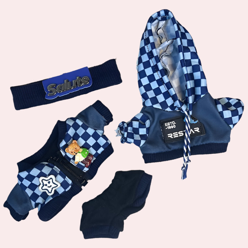 Blue and checkered pet outfit with accessories on a pink background