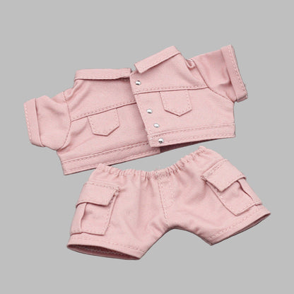 Pink jacket and shorts set on a gray background